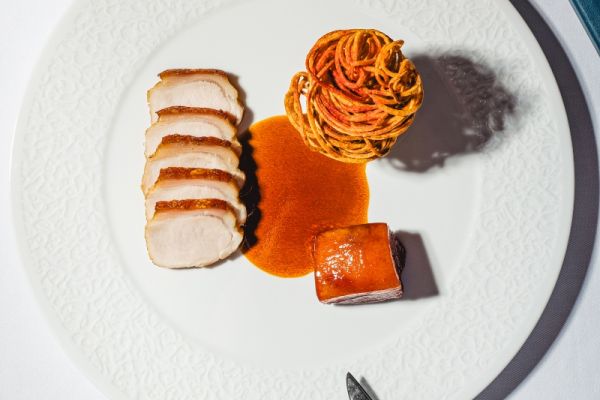 Brassói-style pork loin with fermented cucumber and confit garlic